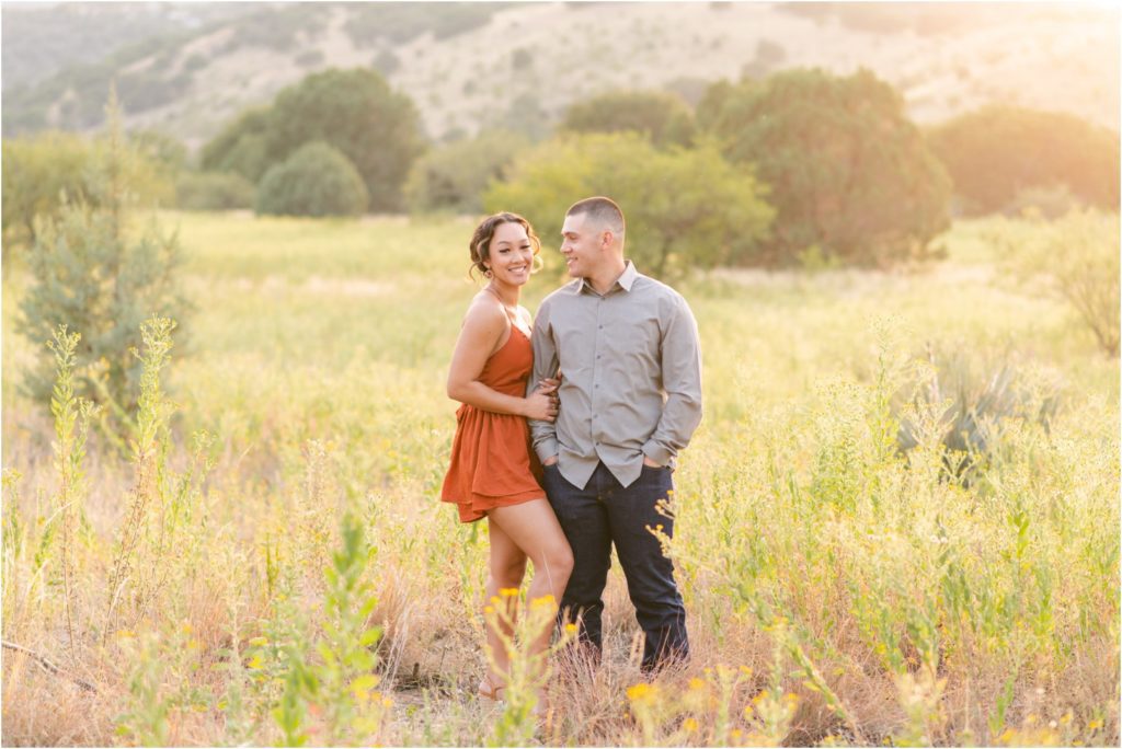 girl smiling at camera while husband smiles at her Sierra Vista photographer Christy Hunter