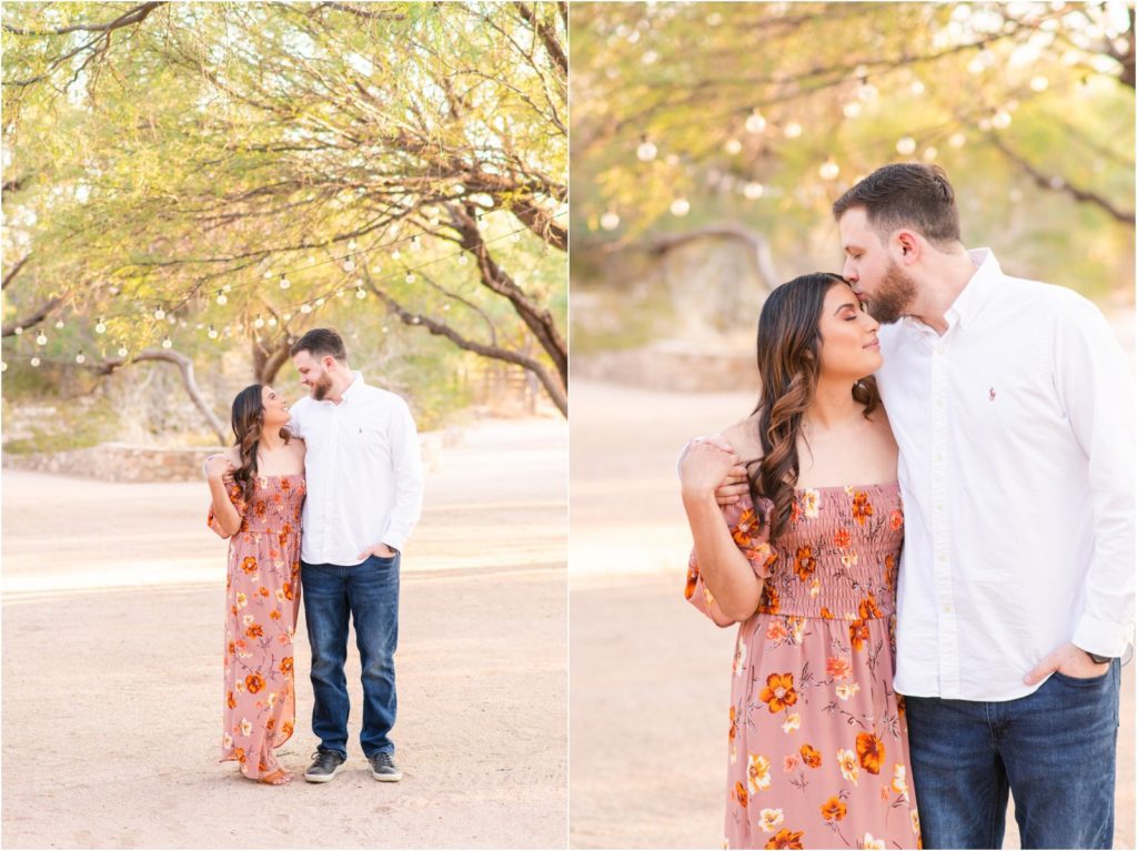 couple walking together closely under string lights during Tucson engagement session