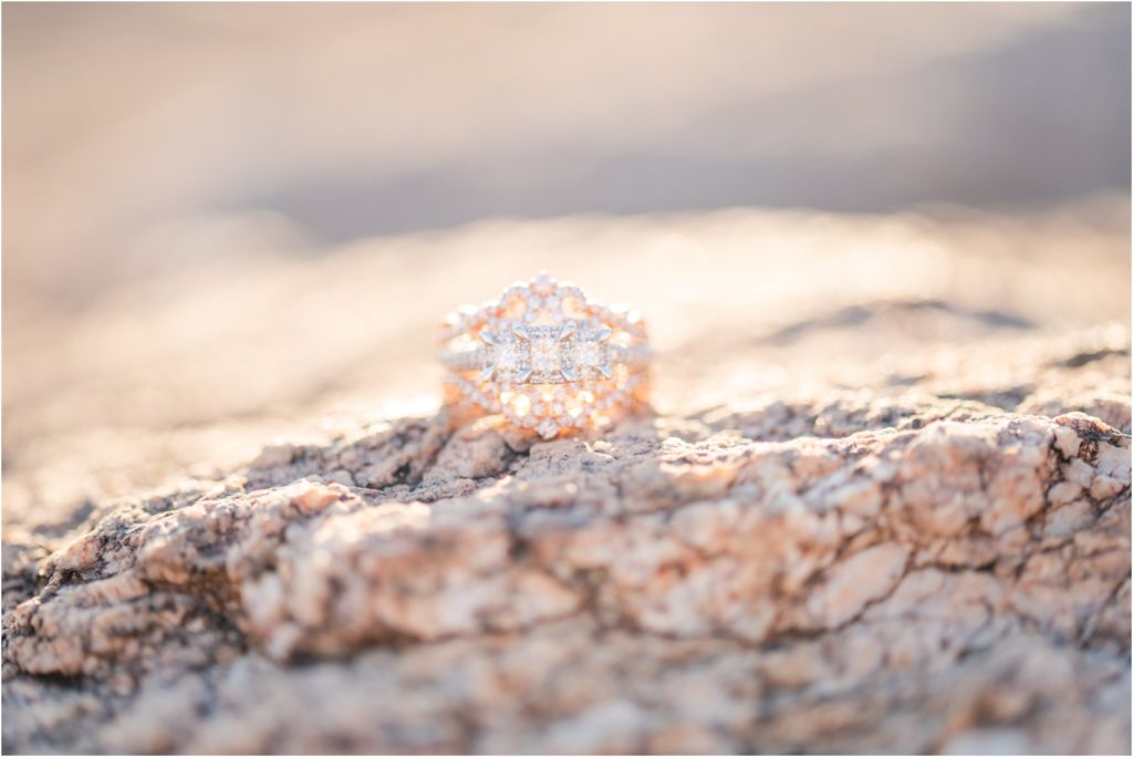 intricate engagement ring on stones in Tucson desert by Tucson wedding photographer Christy Hunter