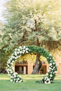 wedding ceremony arch with white florals created by Alexis Grace Florals in Tucson AZ