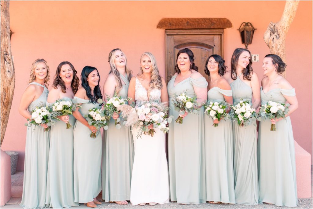 bride with her bridesmaids outside bridal sweet