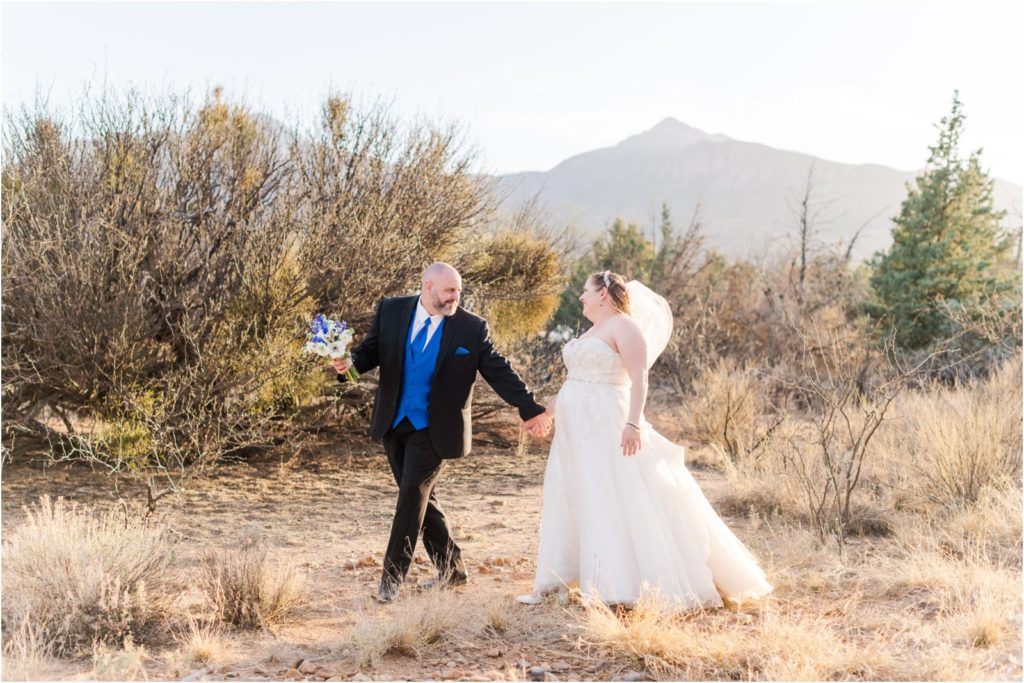 bride and groom walking in desert in southern Arizona