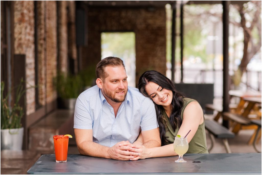 couple at brewery for engagement photos in downtown Tucson