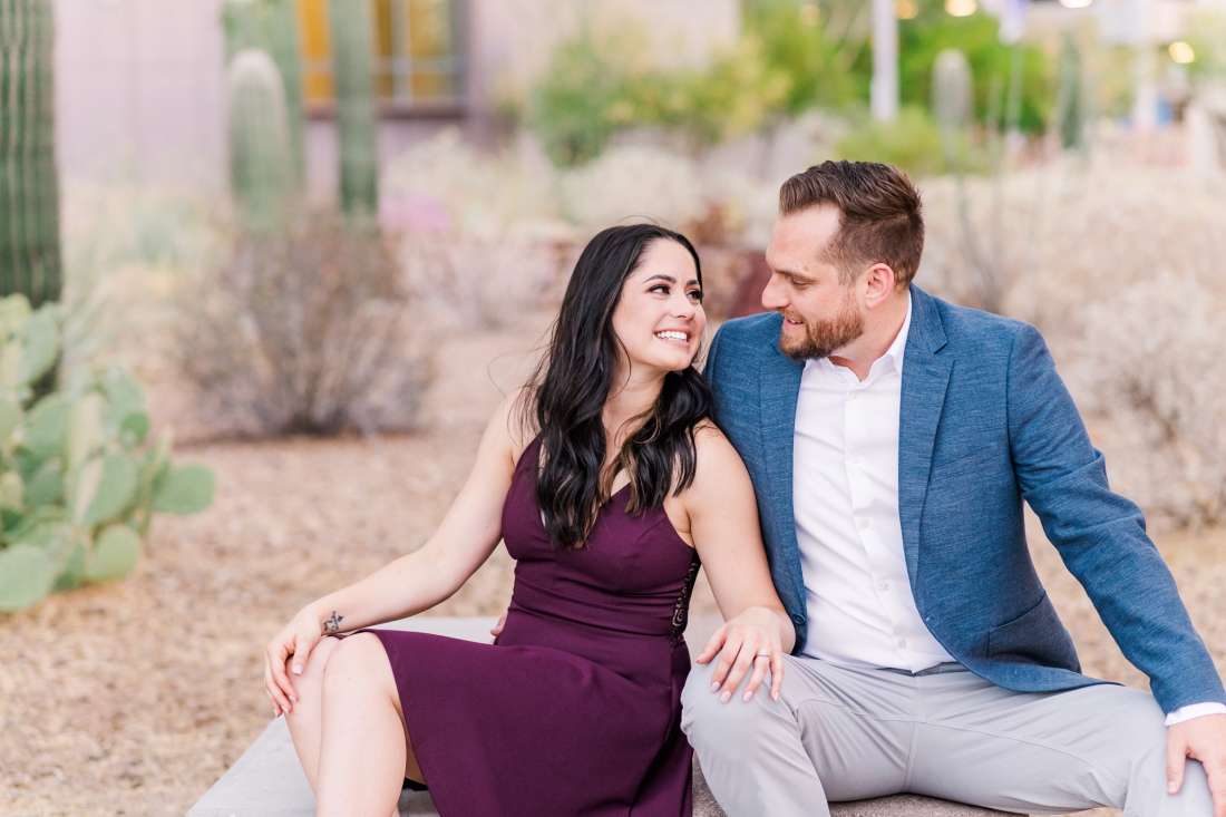 newly engaged couple in downtown Tucson sitting on bench