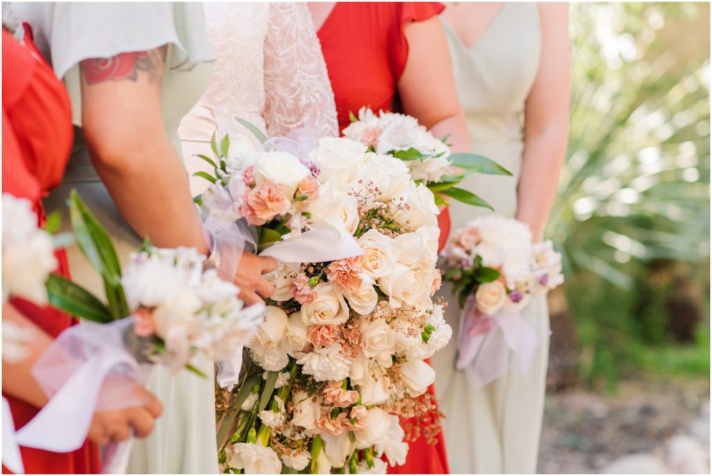bride and bridesmaids bouquets and dresses