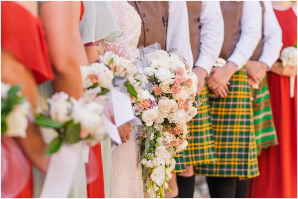 colorful bridal party attire groomsmen in kilts