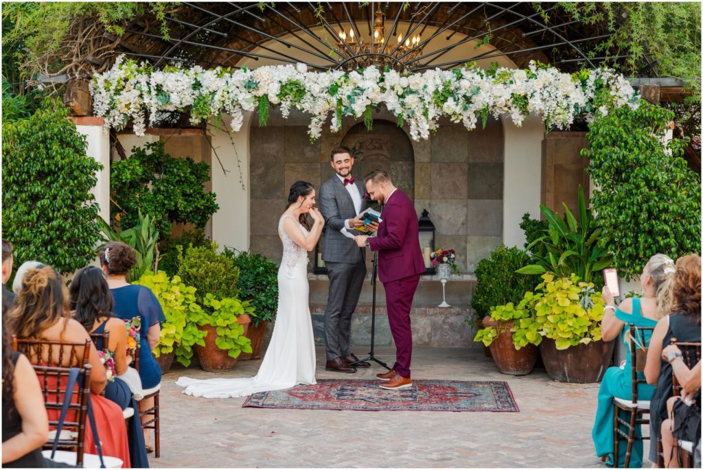 groom reading wedding vows to bride in Stillwell House courtyard ceremony