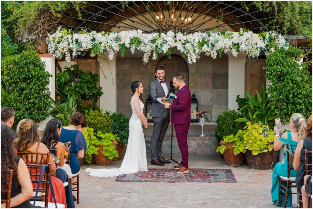 groom reading wedding vows to bride in Stillwell House courtyard ceremony