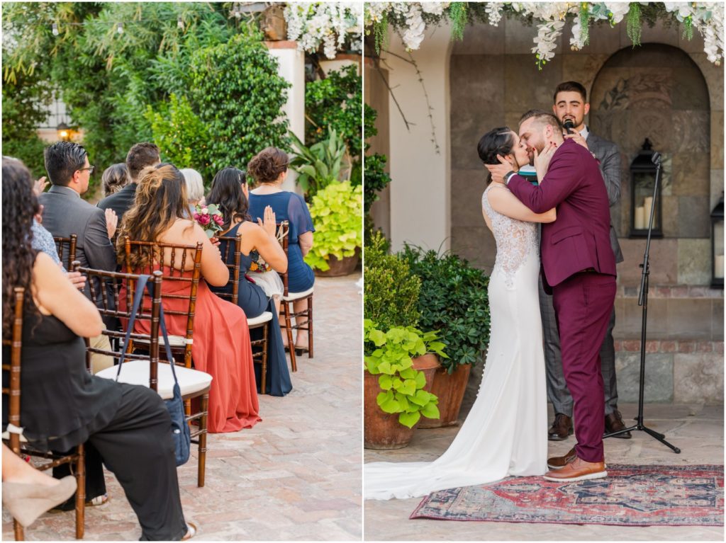 bride and groom first kiss during Stillwell House wedding ceremony in courtyard