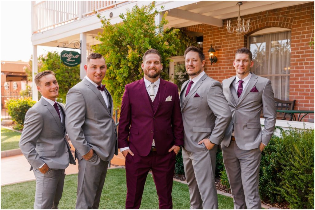 groom and groomsmen portraits on front lawn in front of Twiggs House at Stillwell House