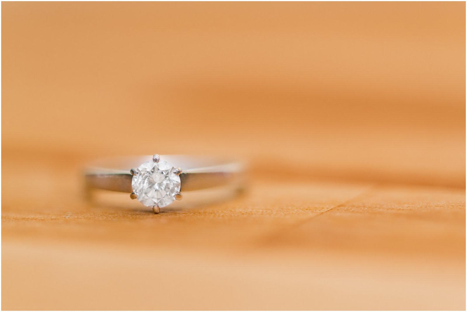 engagement ring on butchers block countertop during indoor session