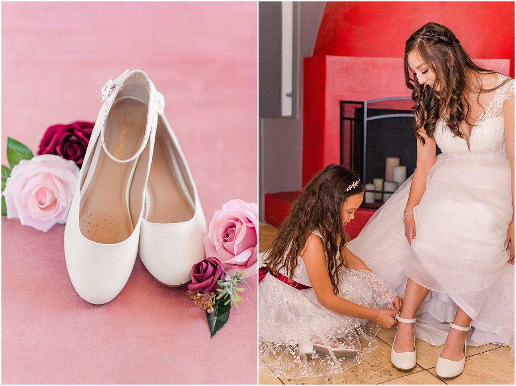 flower girl putting on bride's shoes for her