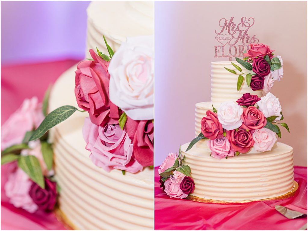 three tiered wedding cake with burgundy, blush, and white flowers for spring wedding