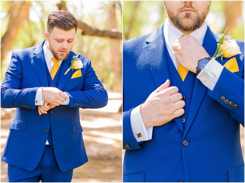 groom adjusting tie and jacket sleeves