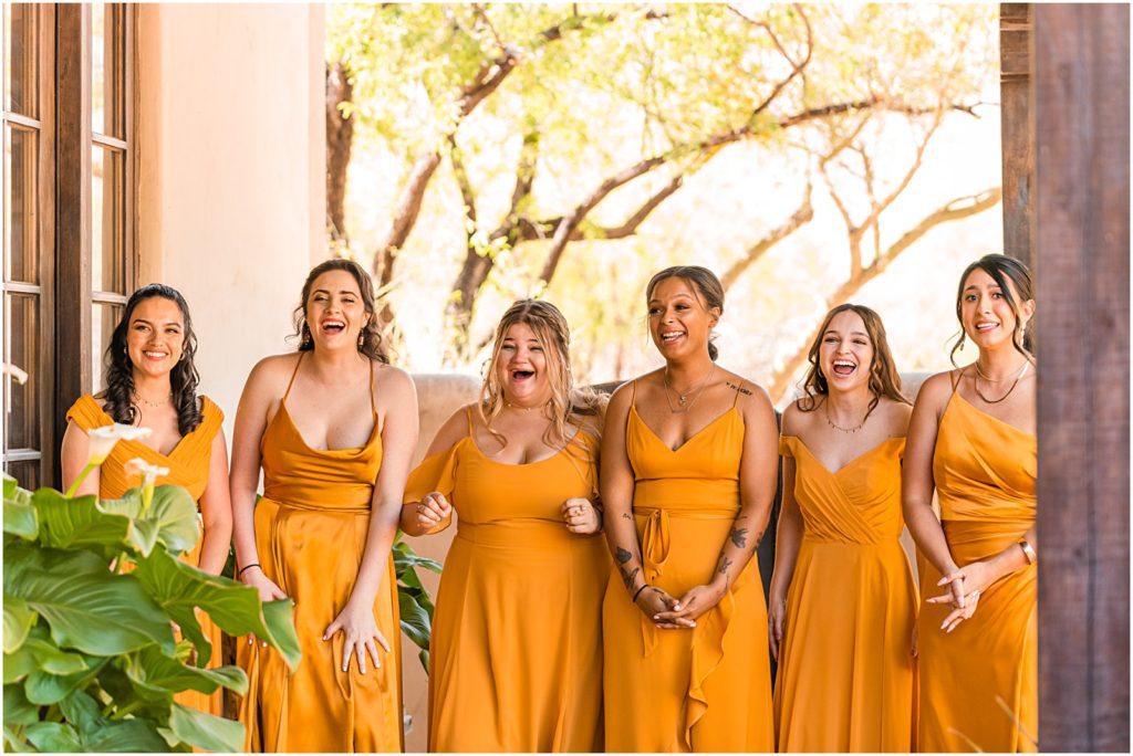tearful reaction of bridesmaids seeing bride in her wedding dress