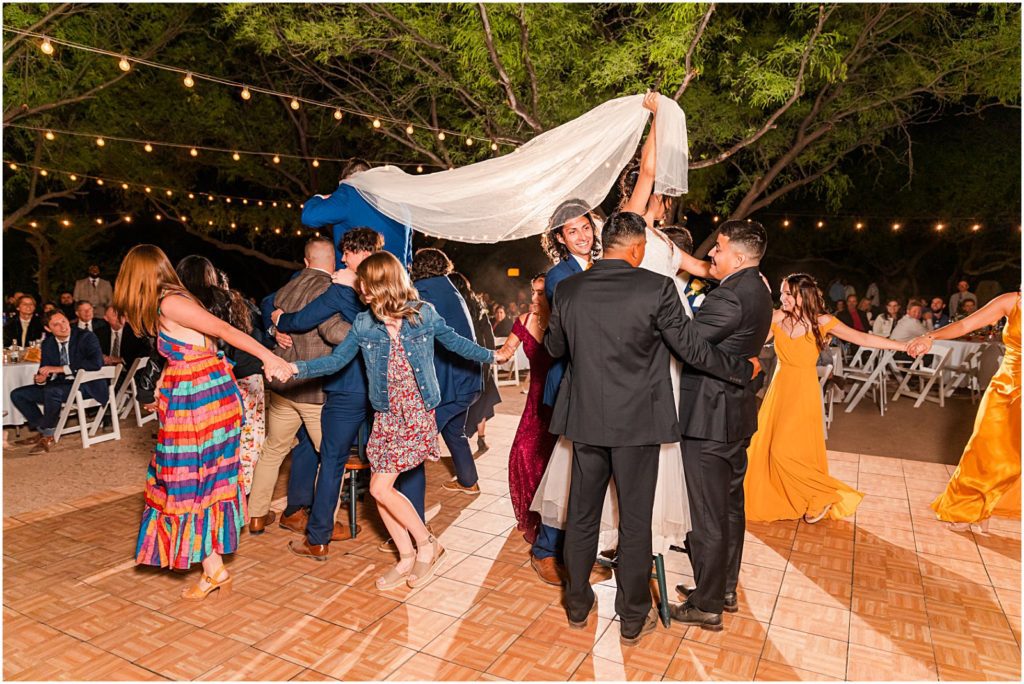 traditional Mexican piñata dance during outdoor wedding reception