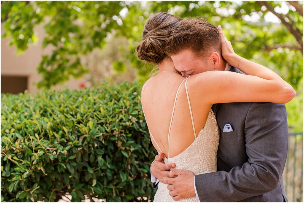 bride and groom hugging after emotional First Look tears