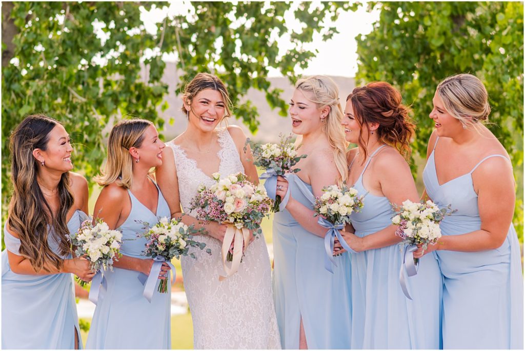 bridesmaids in light blue dresses for destination wedding in Sedona
