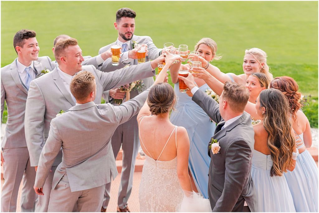 bridal party toasts together after wedding ceremony
