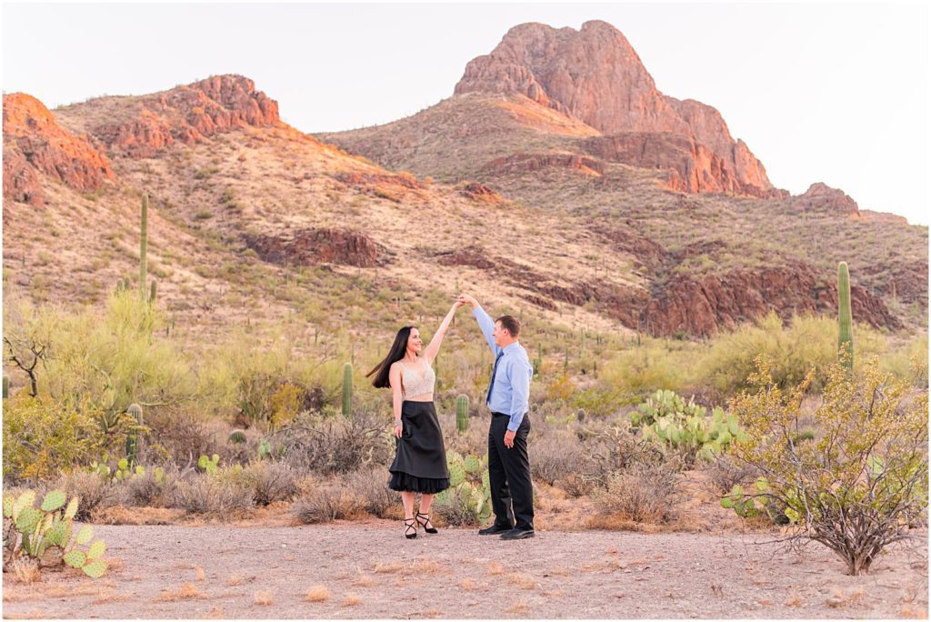 couple dancing together in desert near Safford Peak in summer