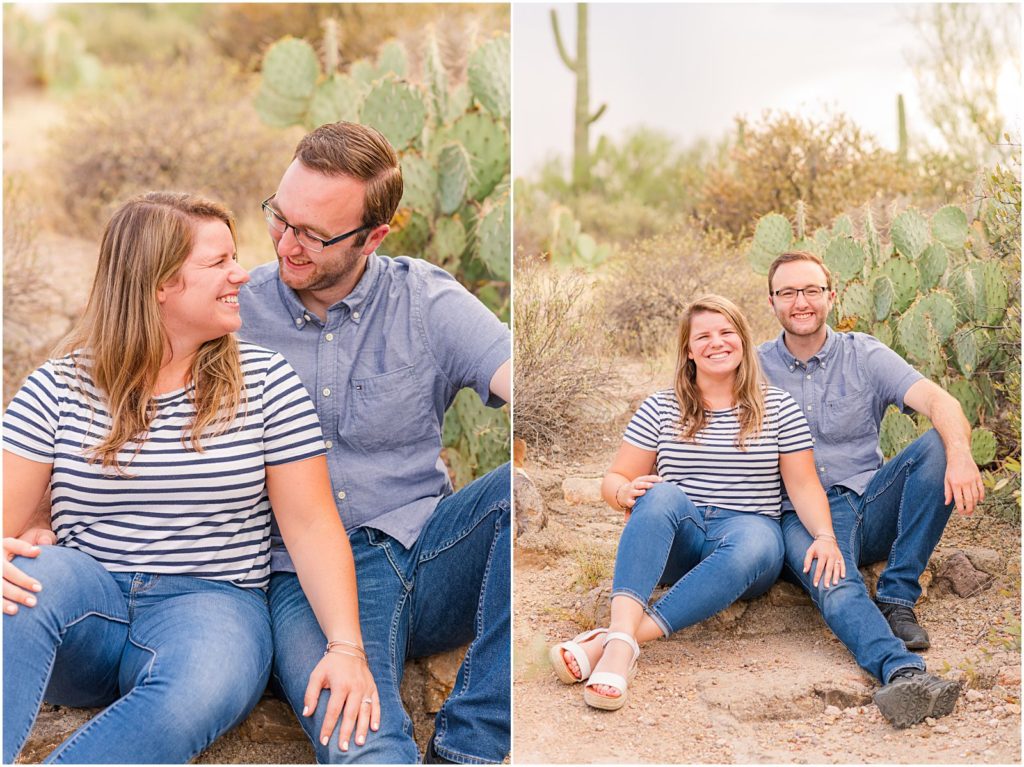 engaged couple sitting together on stone steps in desert
