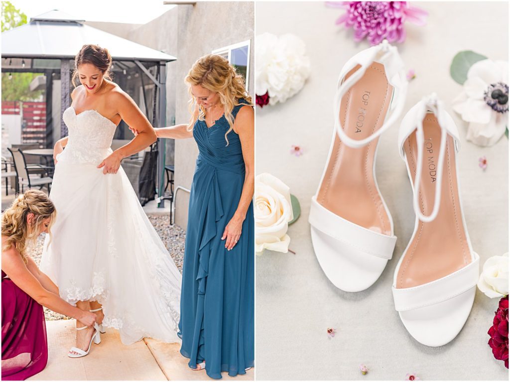 bride putting on wedding shoes with help from bridesmaid