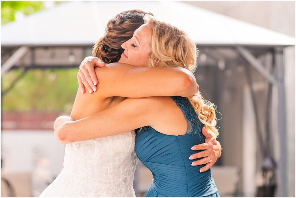 bride and her mom hugging each other