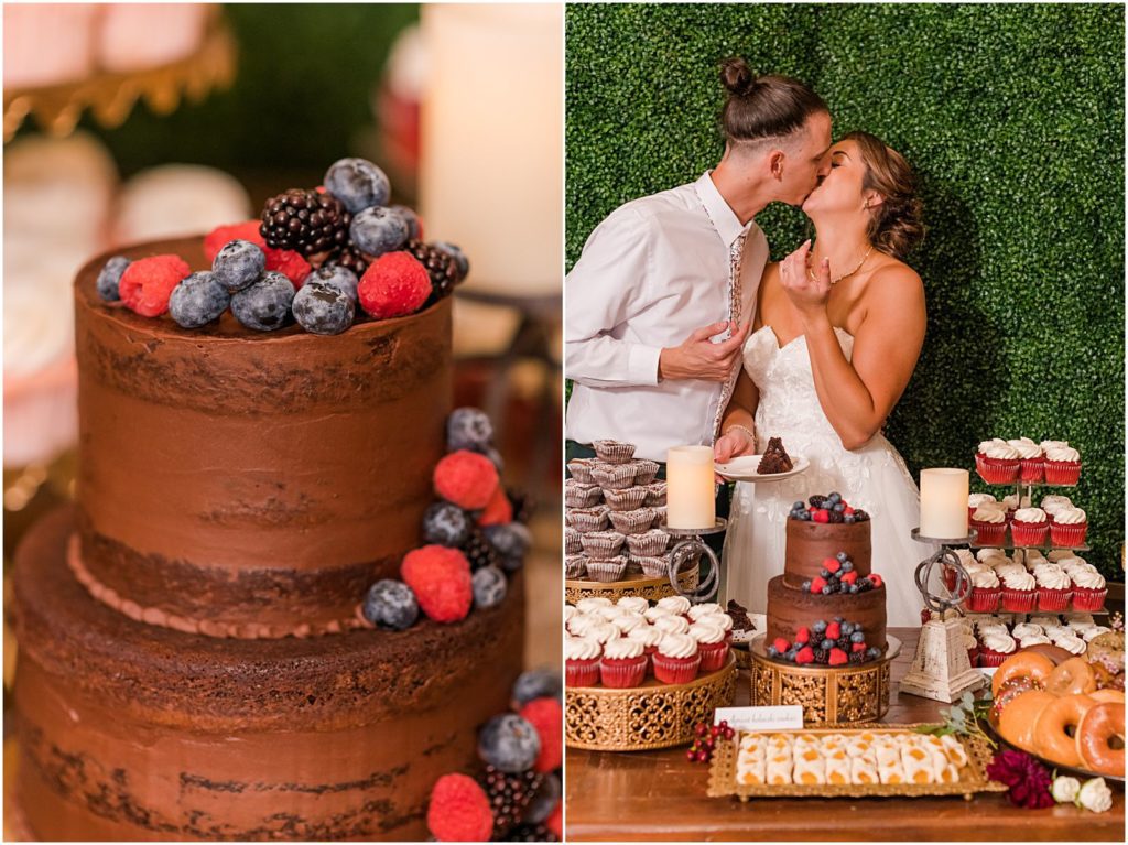 just married couple kissing behind wedding cake