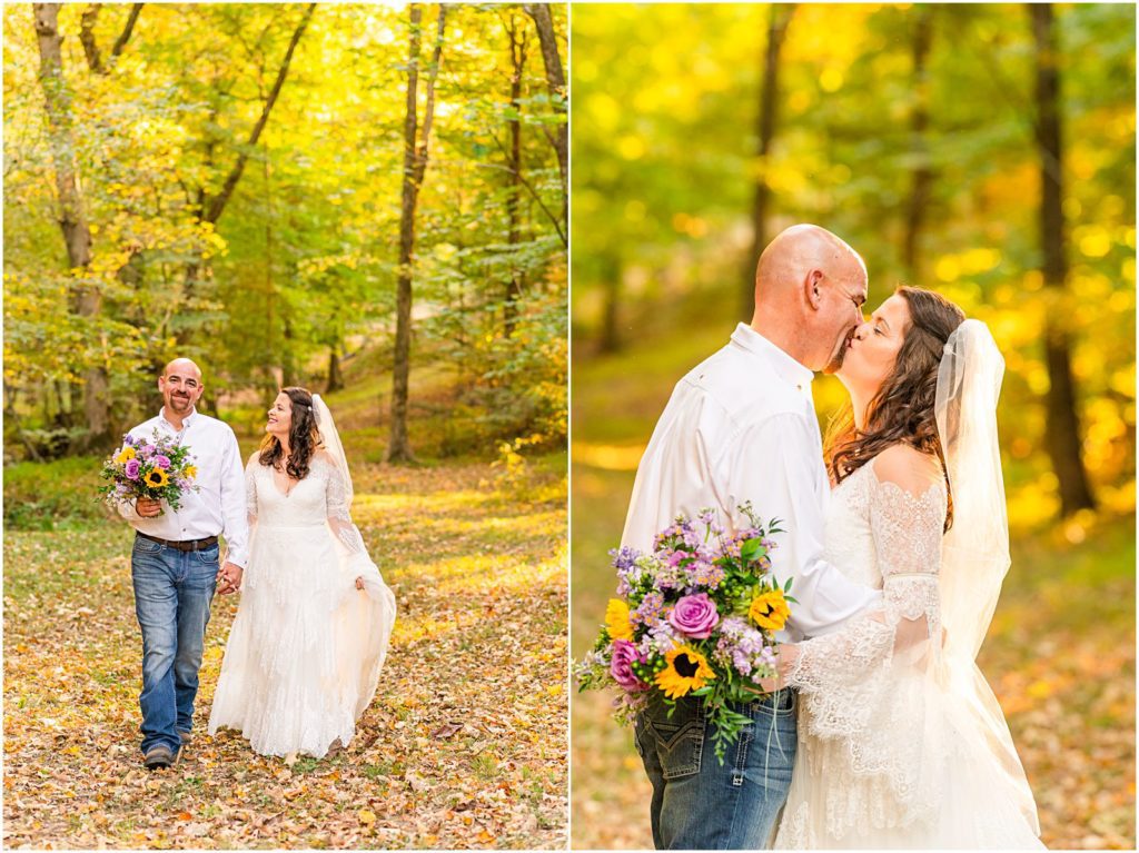 couple walking together in woods on wedding day