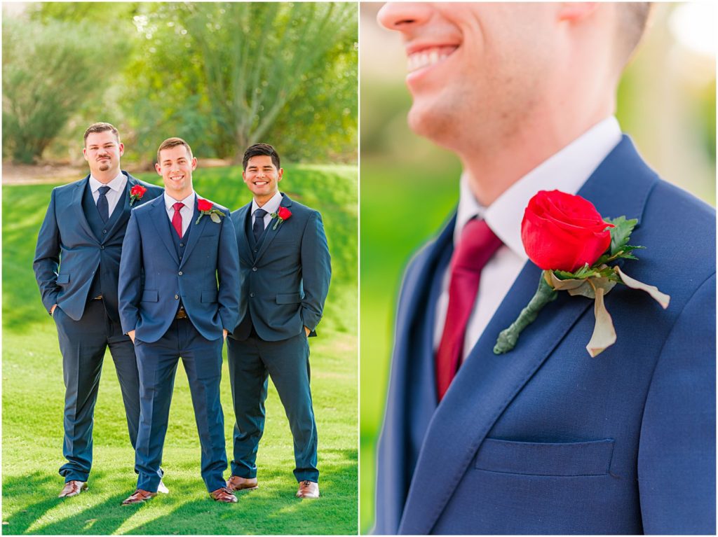groom smiling with his groomsmen in blue suits