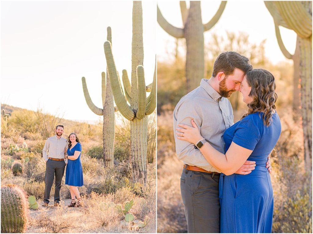 couple in desert with big saguaro cacti behind them