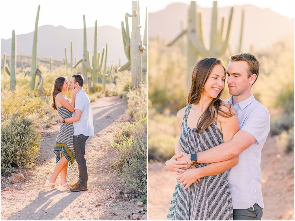 engaged couple smiling at each other in desert