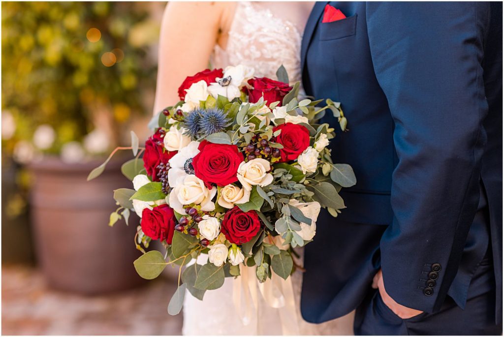 bouquet with red, white, and navy flowers