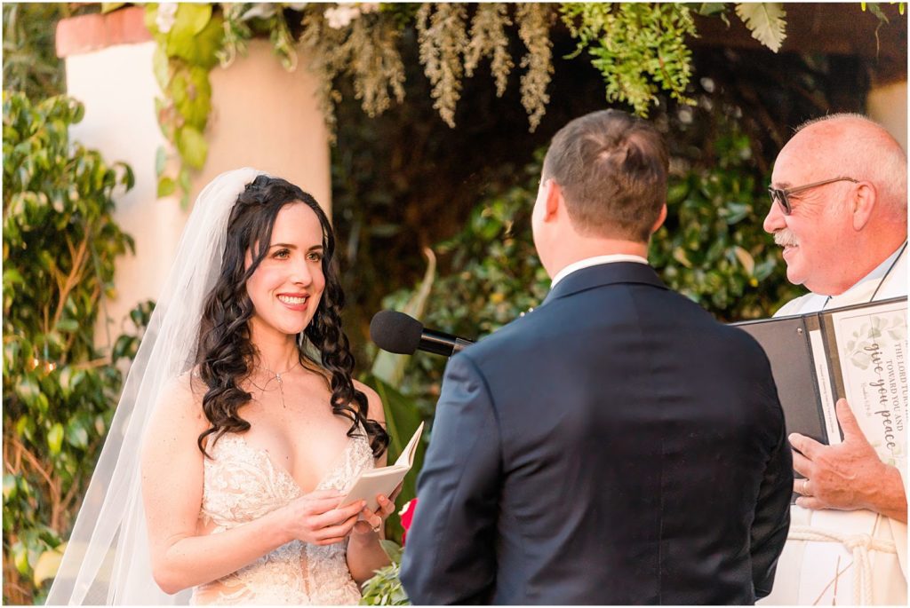 bride reading personal vows during vow renewal ceremony