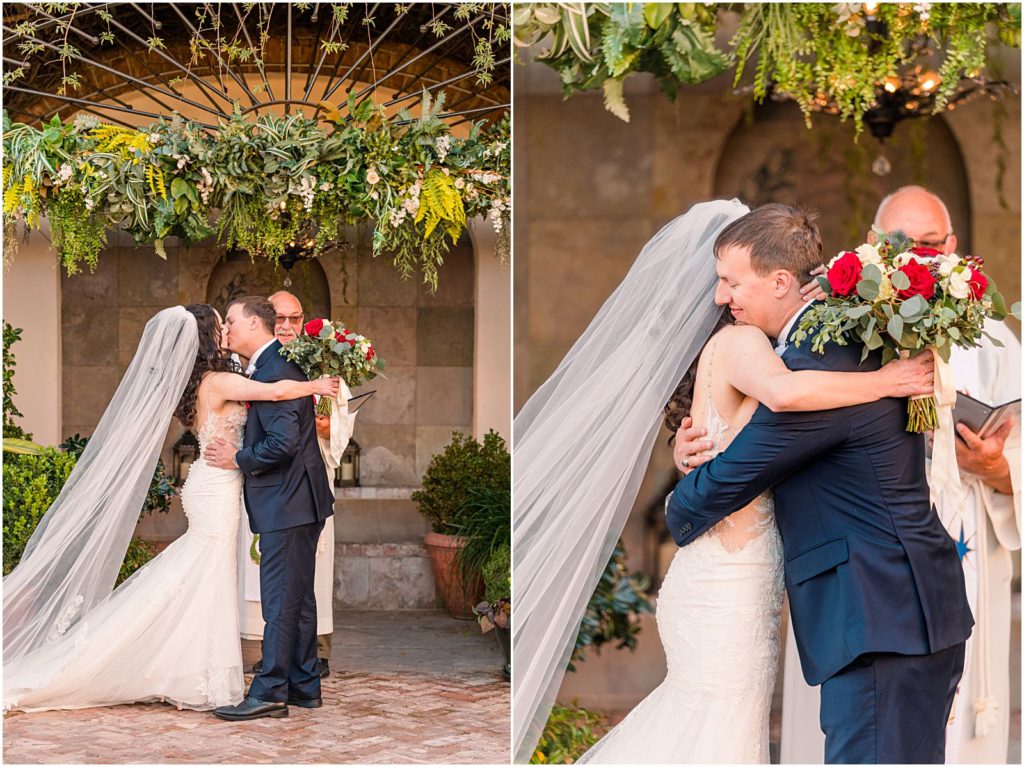 husband and wife hug and kiss at end of vow renewal ceremony