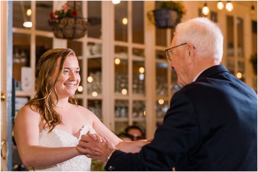 bride dancing with grandfather at wedding reception