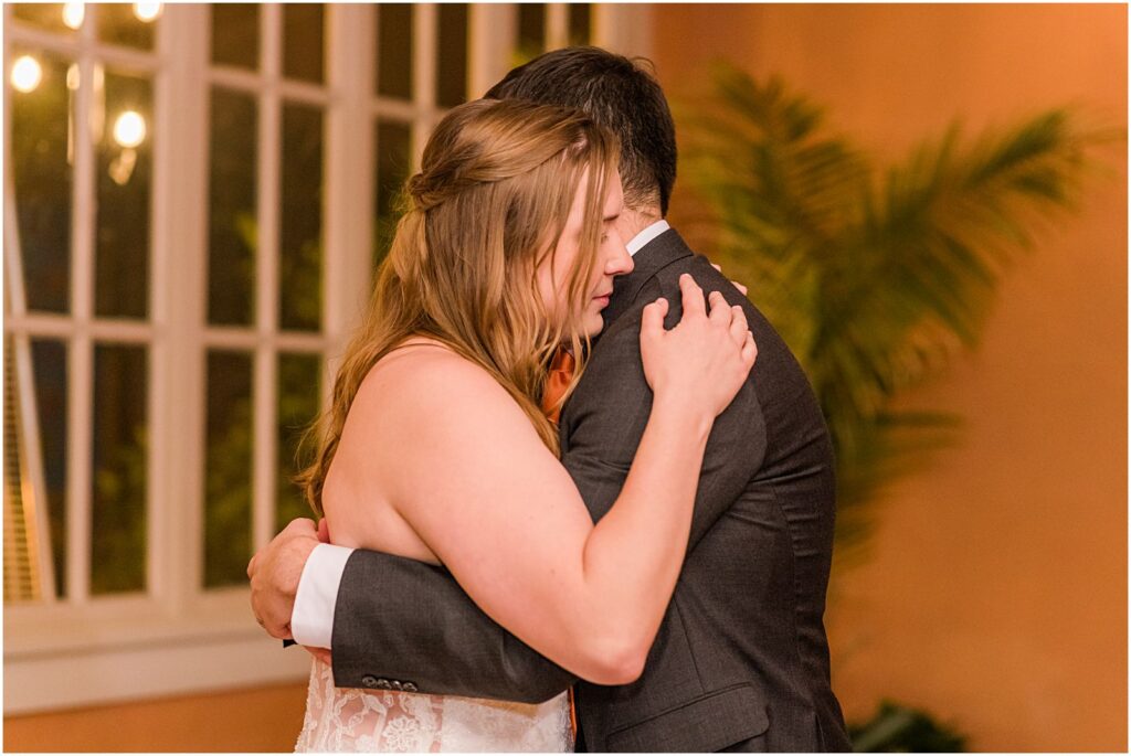 bride hugs groom during last dance