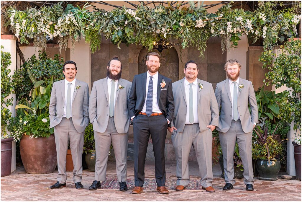 serious photo of groom with is groomsmen on wedding day