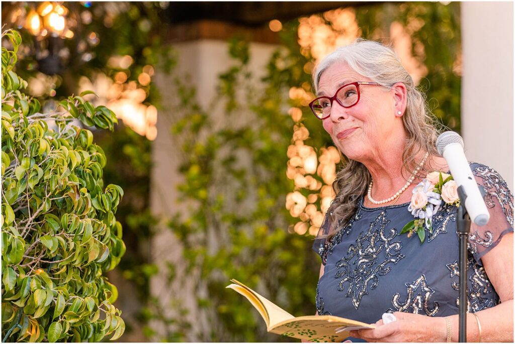 groom's mom reading poem at her son's wedding