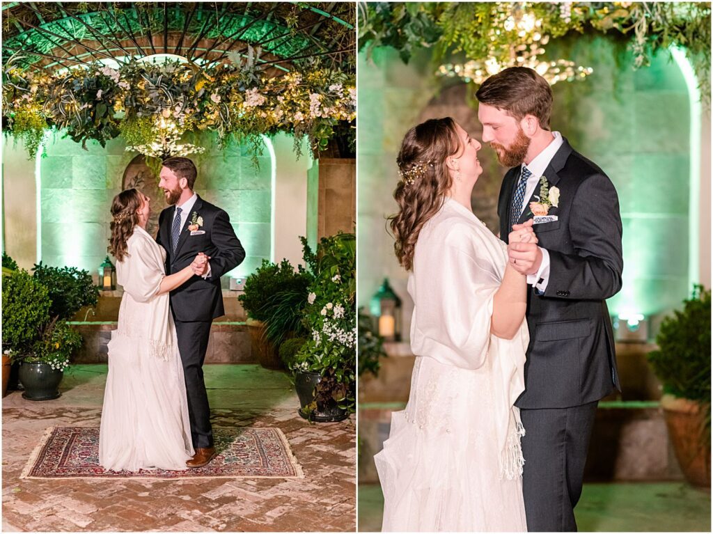 bride and groom dancing outside at night with illuminated arbor behind them