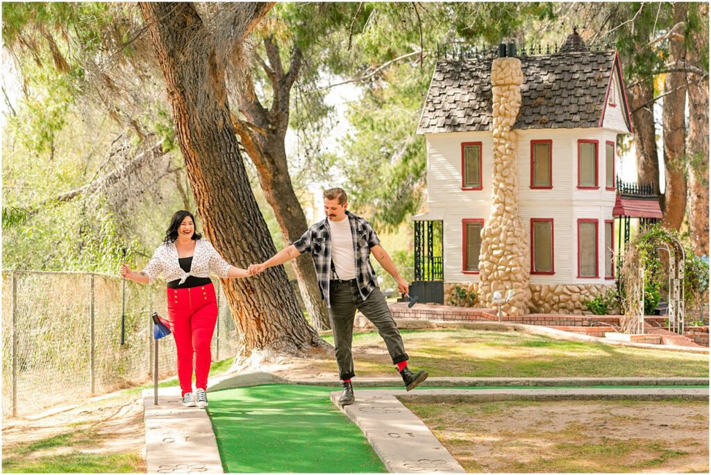 fun and candid engagement photos at mini golf