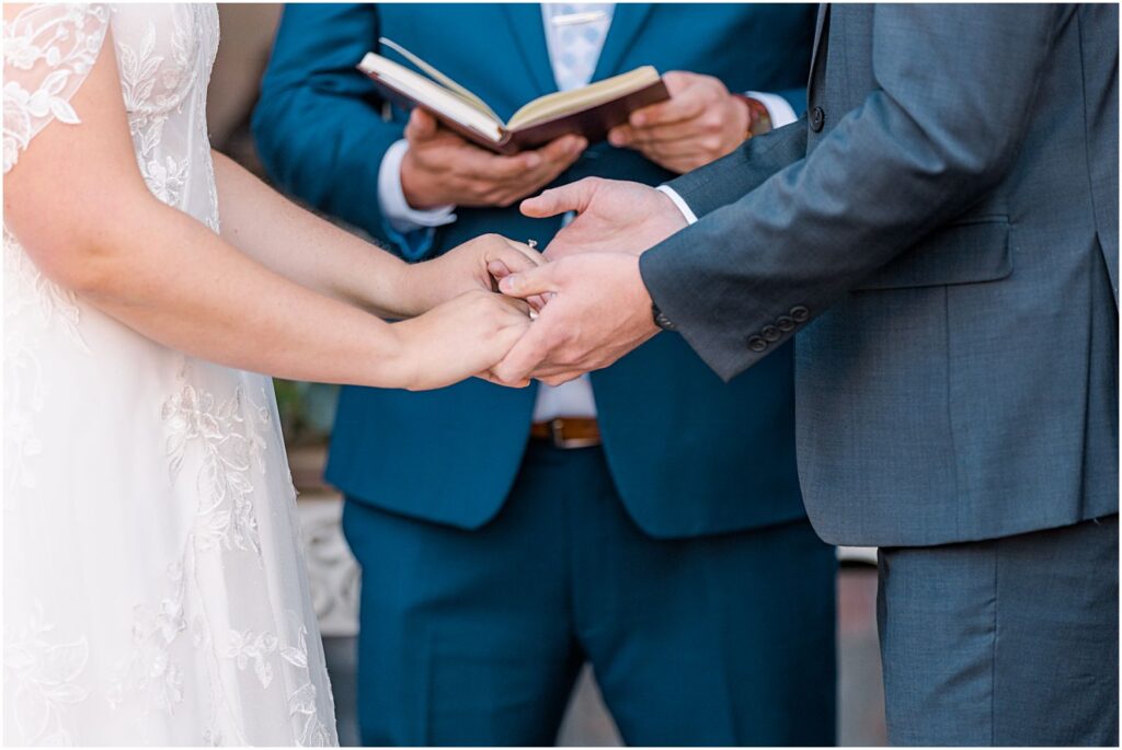 couple holding hands during ceremony
