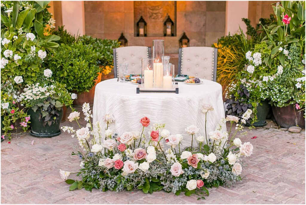 sweetheart table with florals around the base