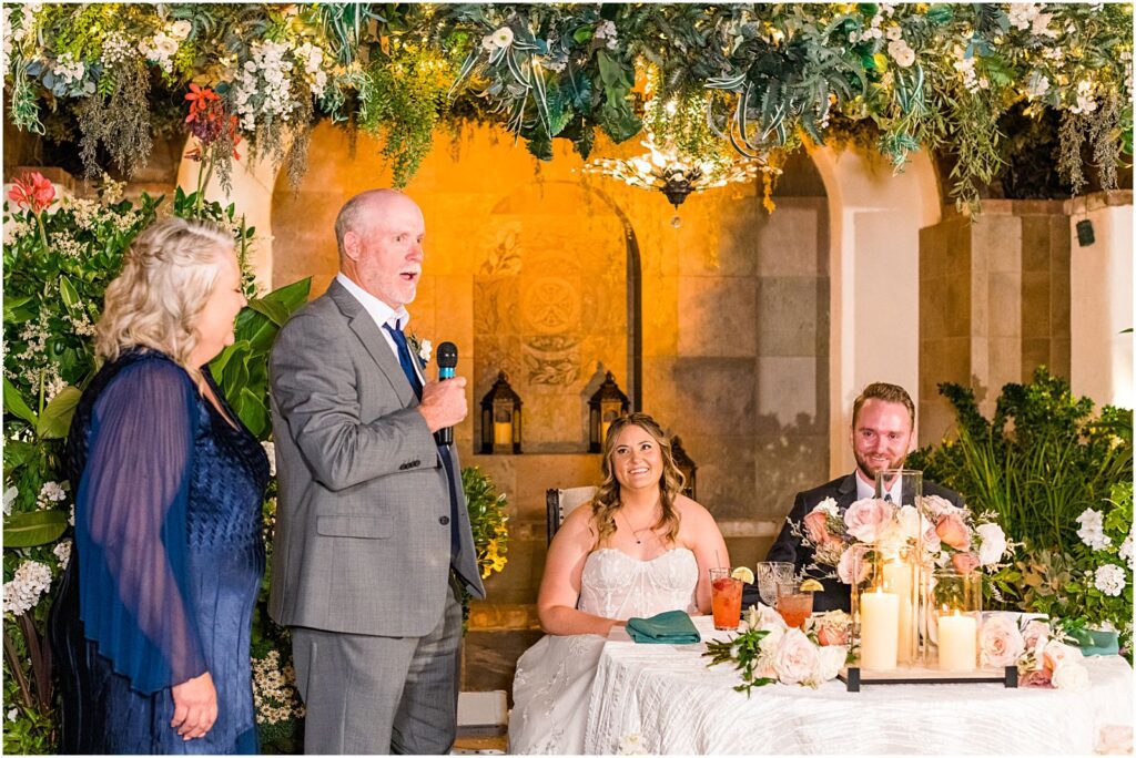 bride's parents giving toast at reception