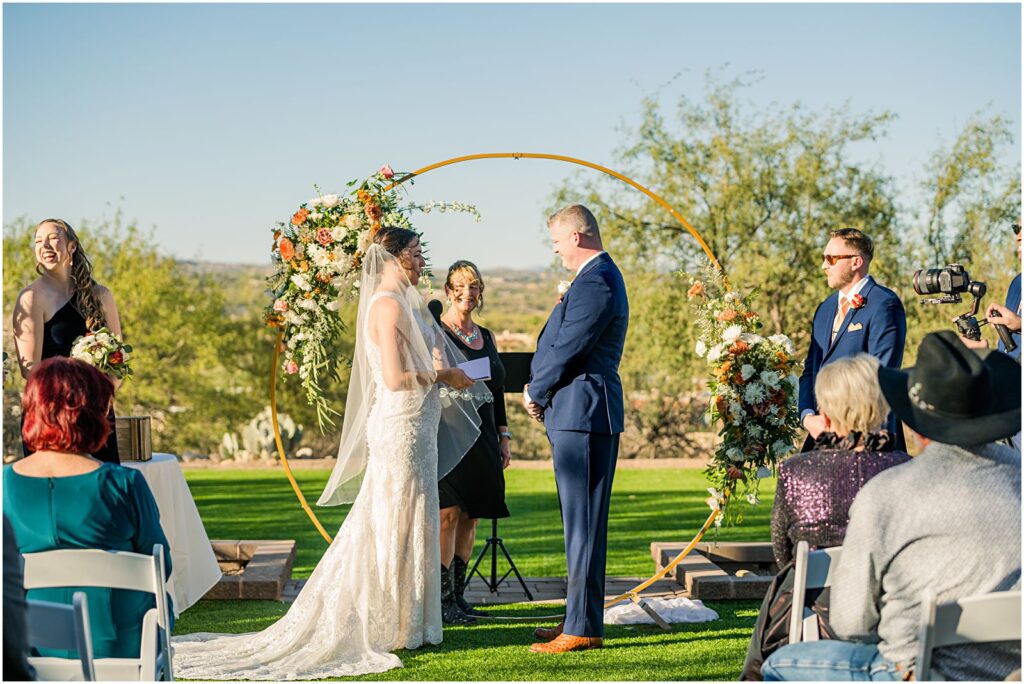 brides reading her vows aloud during ceremony
