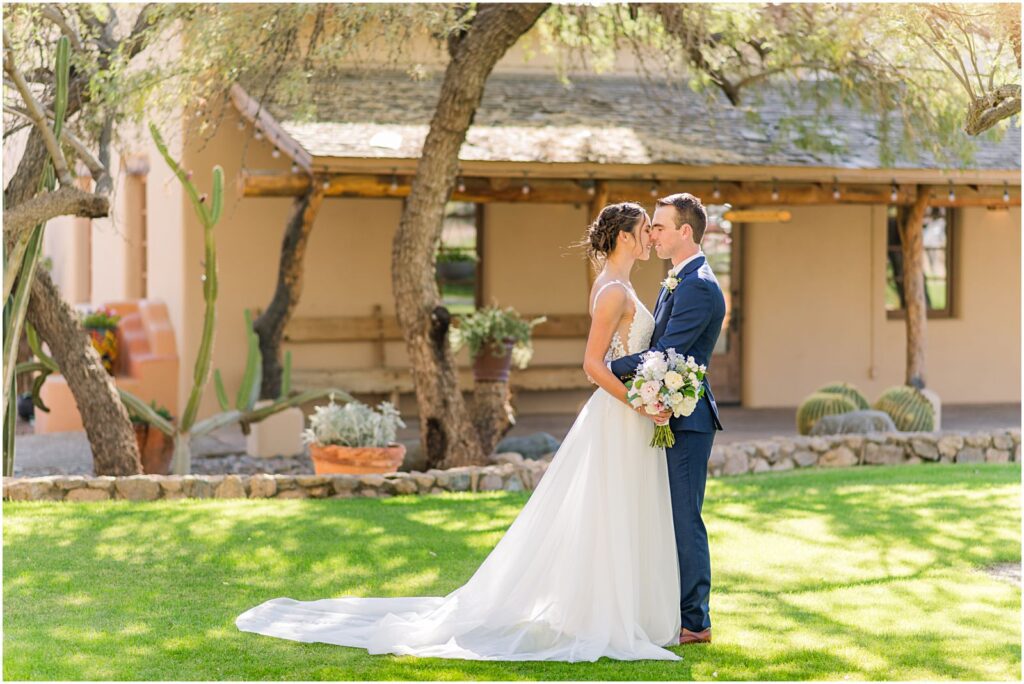 portrait of couple on front lawn at Tanque Verde Ranch wedding in Tucson
